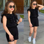Girl wearing The Nile Luxuries black sleeveless button-down ruffled top and matching elastic waist shorts set.
