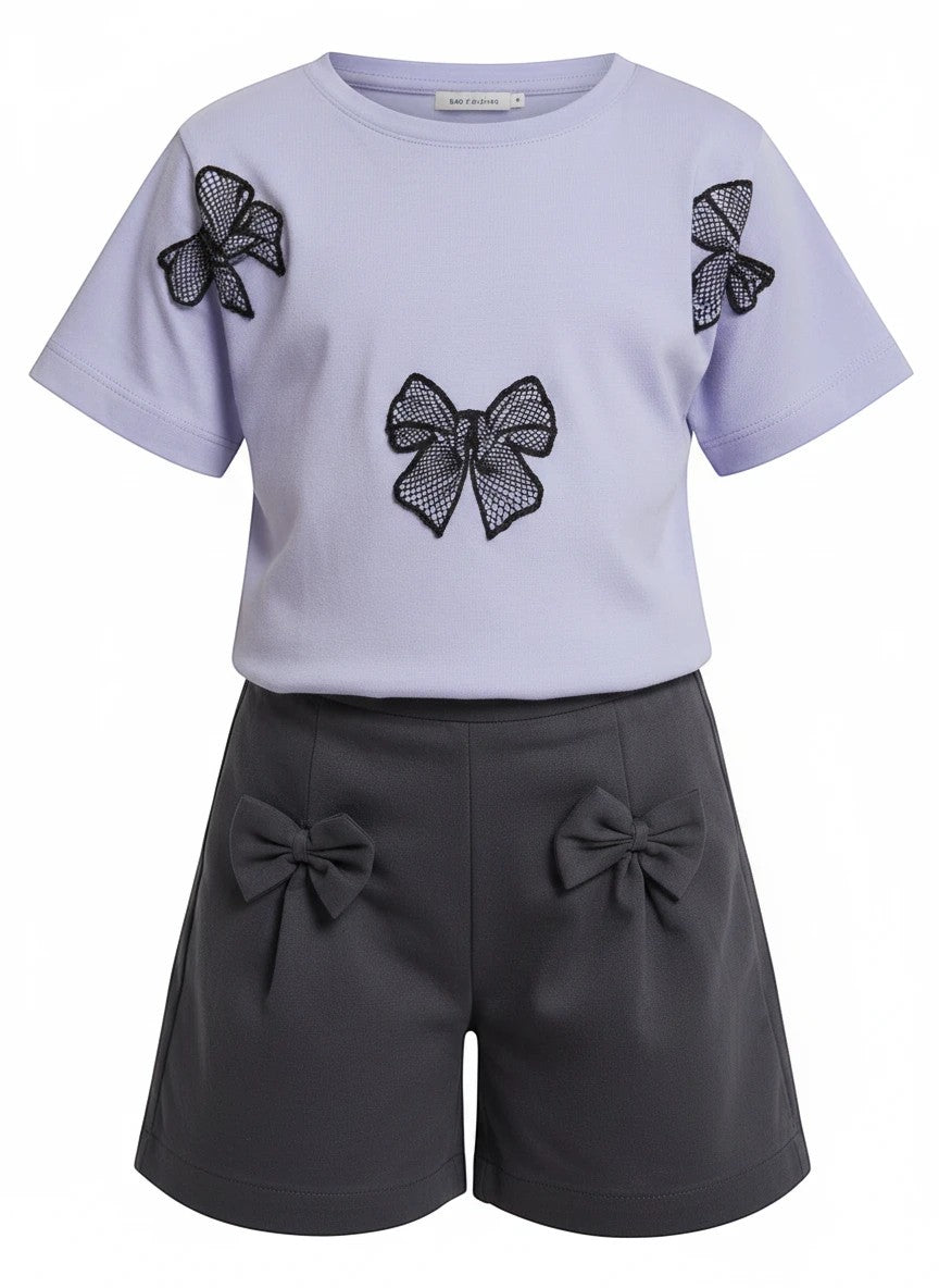 The Nile Luxuries girls summer set with a lavender bow-appliqued t-shirt and charcoal grey shorts with bow details.
