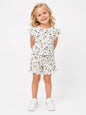 The Nile Luxuries girls white lounge set with bunny print, flutter sleeves, and ruffle trim on shorts and top.