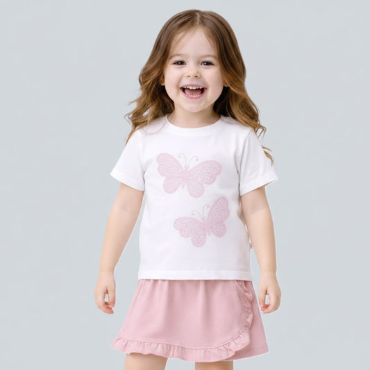 The Nile Luxuries girls white cotton t-shirt with pink glitter butterfly appliques and pink ruffled skirt.