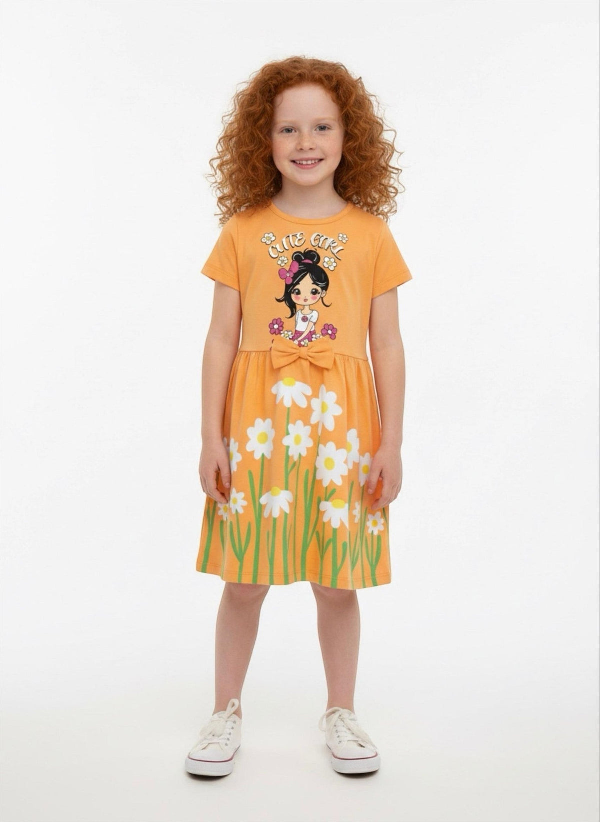 The Nile Luxuries girls orange casual dress with daisy print, Cute Girl graphic, and waist bow on a young model.
