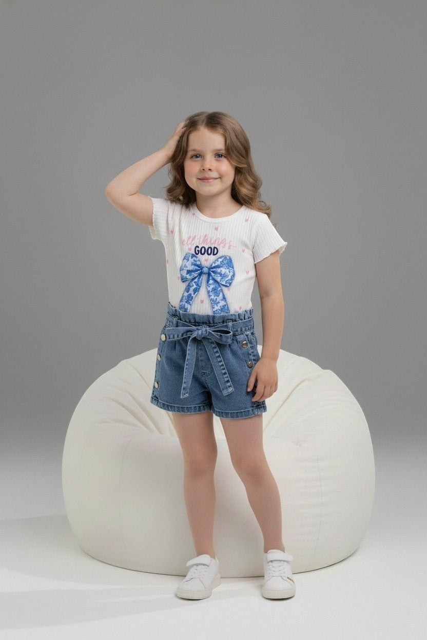 The Nile Luxuries girl's outfit with a ribbed graphic top, blue bow, and denim paper-bag waist shorts with tie belt.
