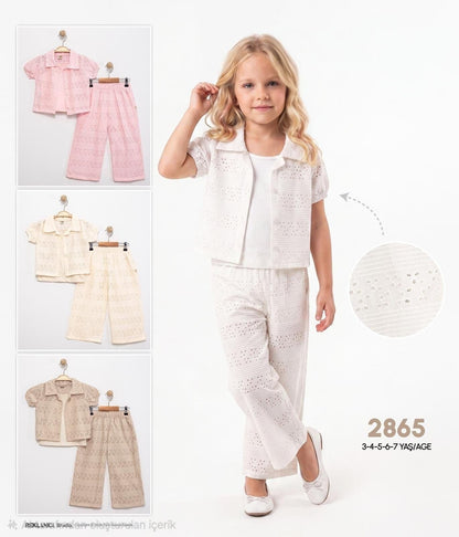 The Nile Luxuries girls eyelet embroidered shirt and wide-leg trouser set in white, featuring floral lace details.