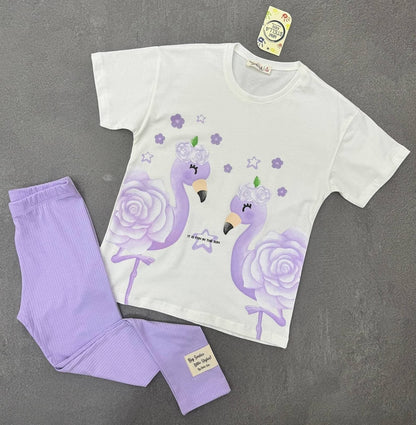 The Nile Luxuries girls two-piece set with a white graphic t-shirt featuring purple flamingos and matching ribbed leggings