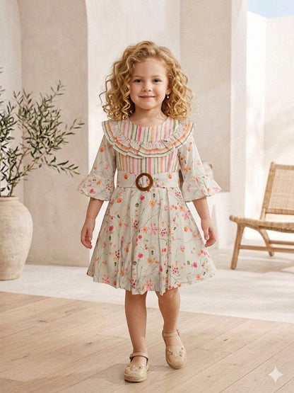 The Nile Luxuries girls' floral print dress with ruffle collar, bell sleeves, and wooden buckle belt. Pastel stripes on bodice.