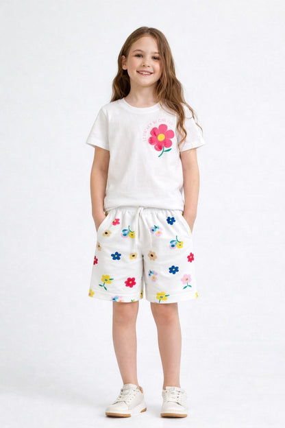 The Nile Luxuries girls white lounge set with a floral graphic t-shirt and matching flower-print drawstring shorts.