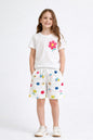 The Nile Luxuries girls white lounge set with a floral graphic t-shirt and matching flower-print drawstring shorts.