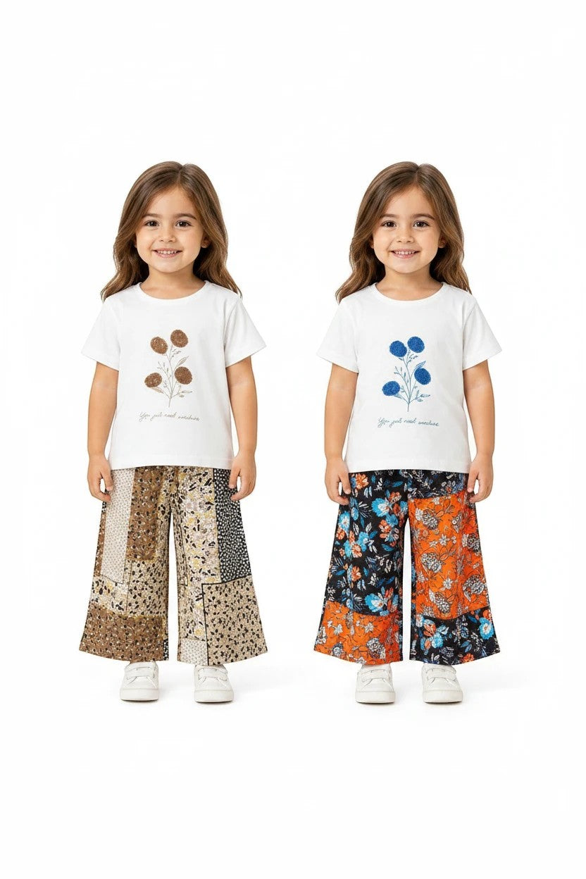 The Nile Luxuries girls' two-piece set with white graphic tees and floral patchwork wide-leg pants on a young model.