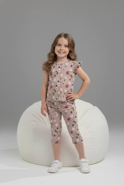 Girl wearing The Nile Luxuries ribbed floral lounge set with flutter sleeves and cropped leggings on a beanbag chair