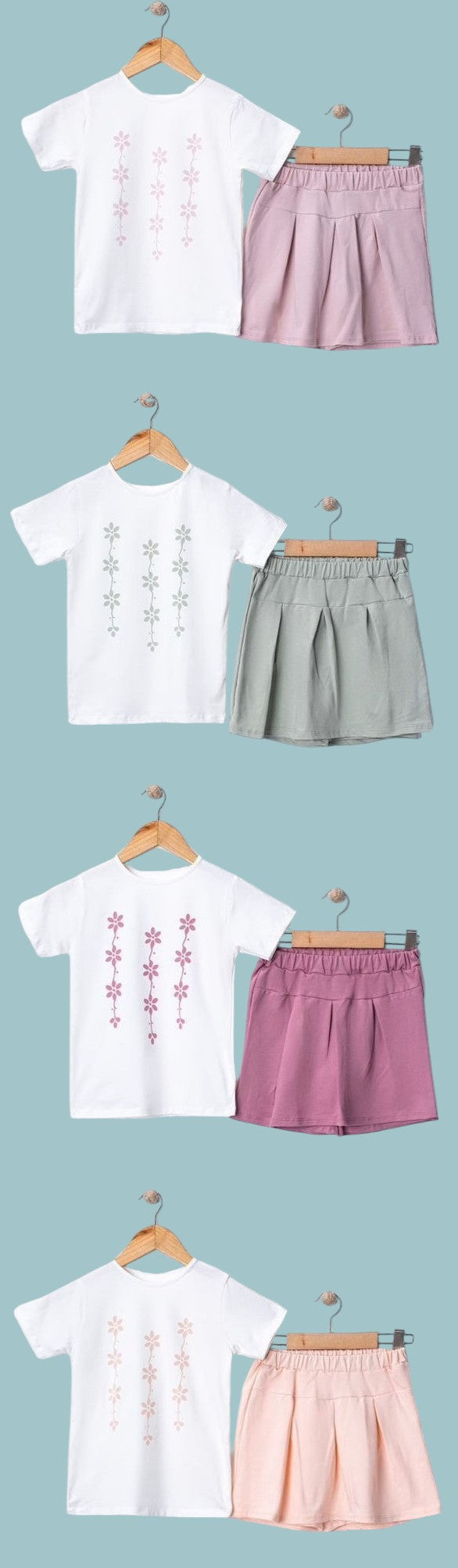 The Nile Luxuries girls' white t-shirt with floral print and pink pleated skirt set. Soft, breathable fabric.