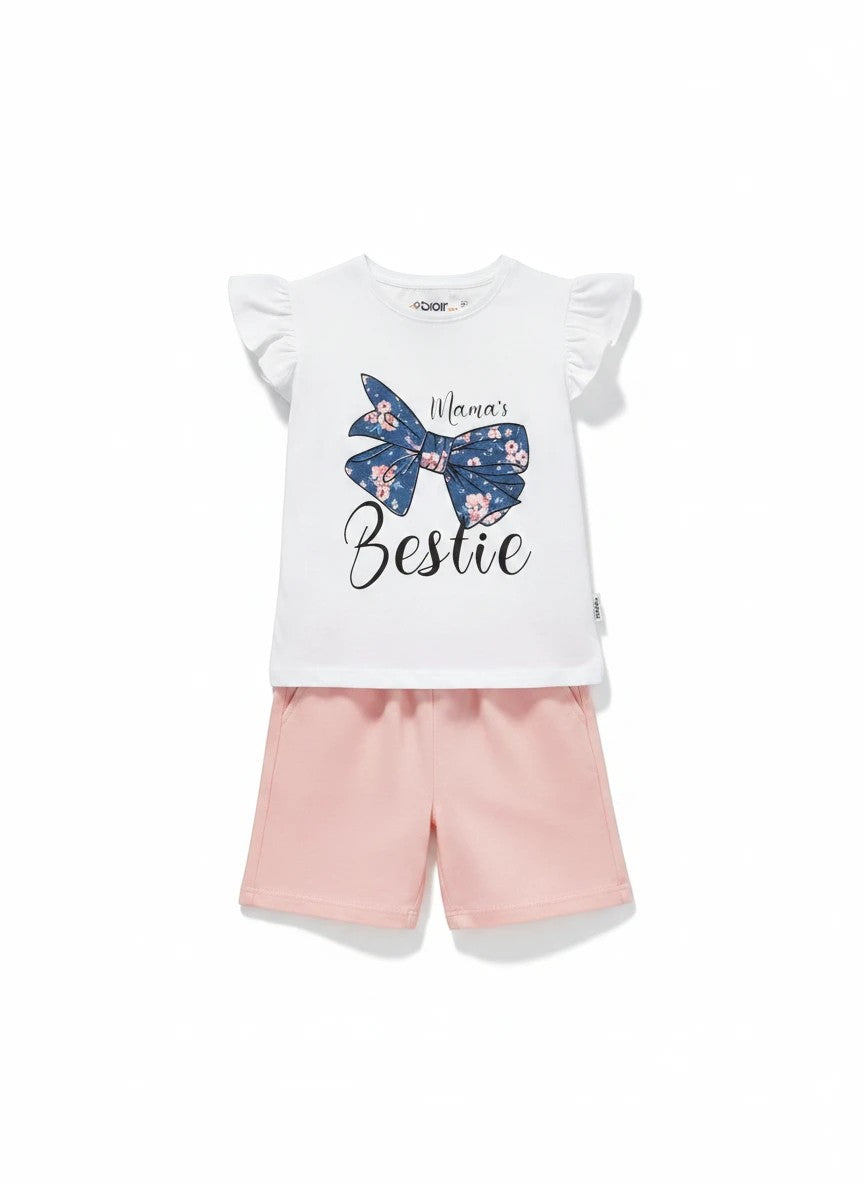The Nile Luxuries white cotton t-shirt with floral bow graphic and "Mama's Bestie" slogan, paired with pink shorts.
