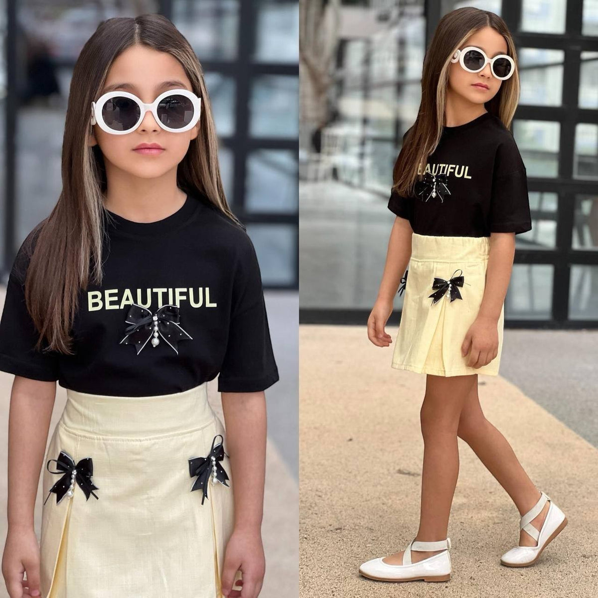 The Nile Luxuries girls black graphic t-shirt with Beautiful text and yellow pleated skirt with bow accents.
