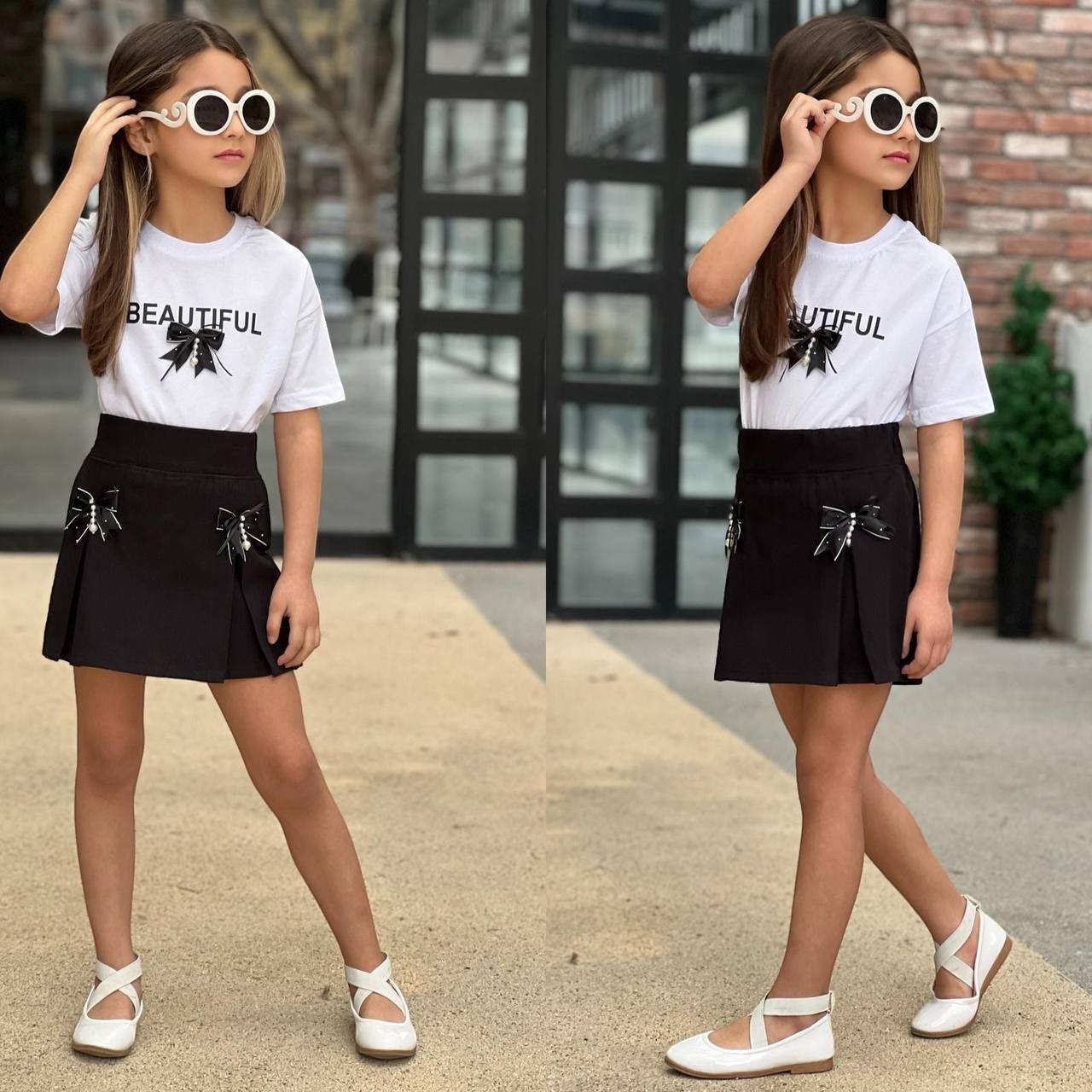 The Nile Luxuries girls white graphic t-shirt with Beautiful text and black pleated skirt with bow accents