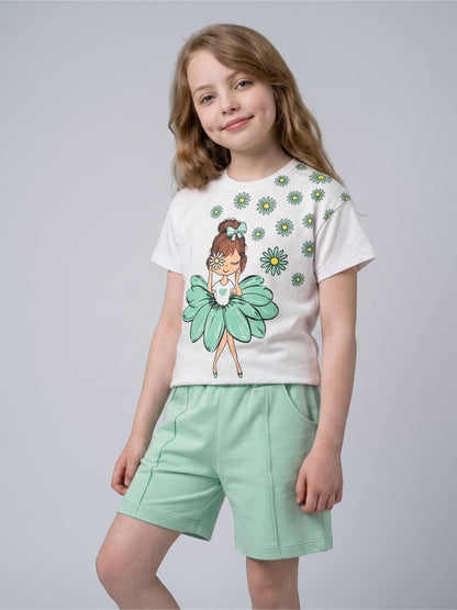 Girl wearing The Nile Luxuries white graphic t-shirt with daisy print and matching mint green shorts set.