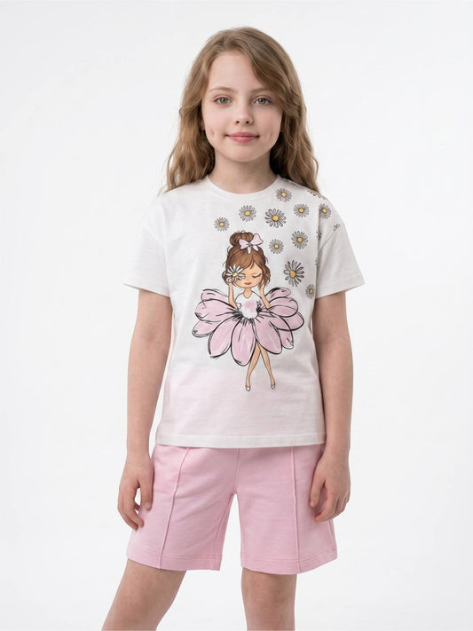 Girl wearing The Nile Luxuries white graphic t-shirt with daisy print and pink shorts with front seam detail.