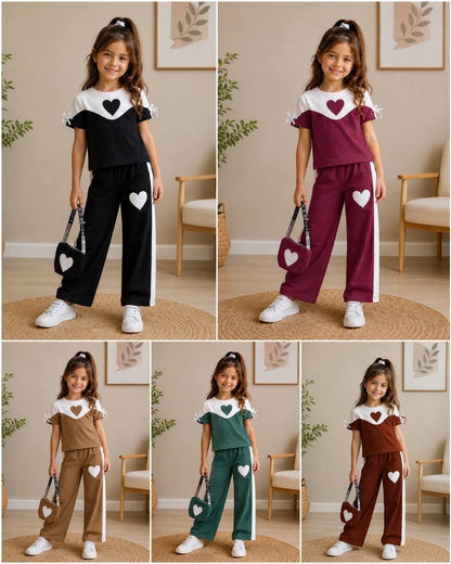 The Nile Luxuries girls heart graphic short sleeve top and wide leg pants lounge set in various colors with matching bags.