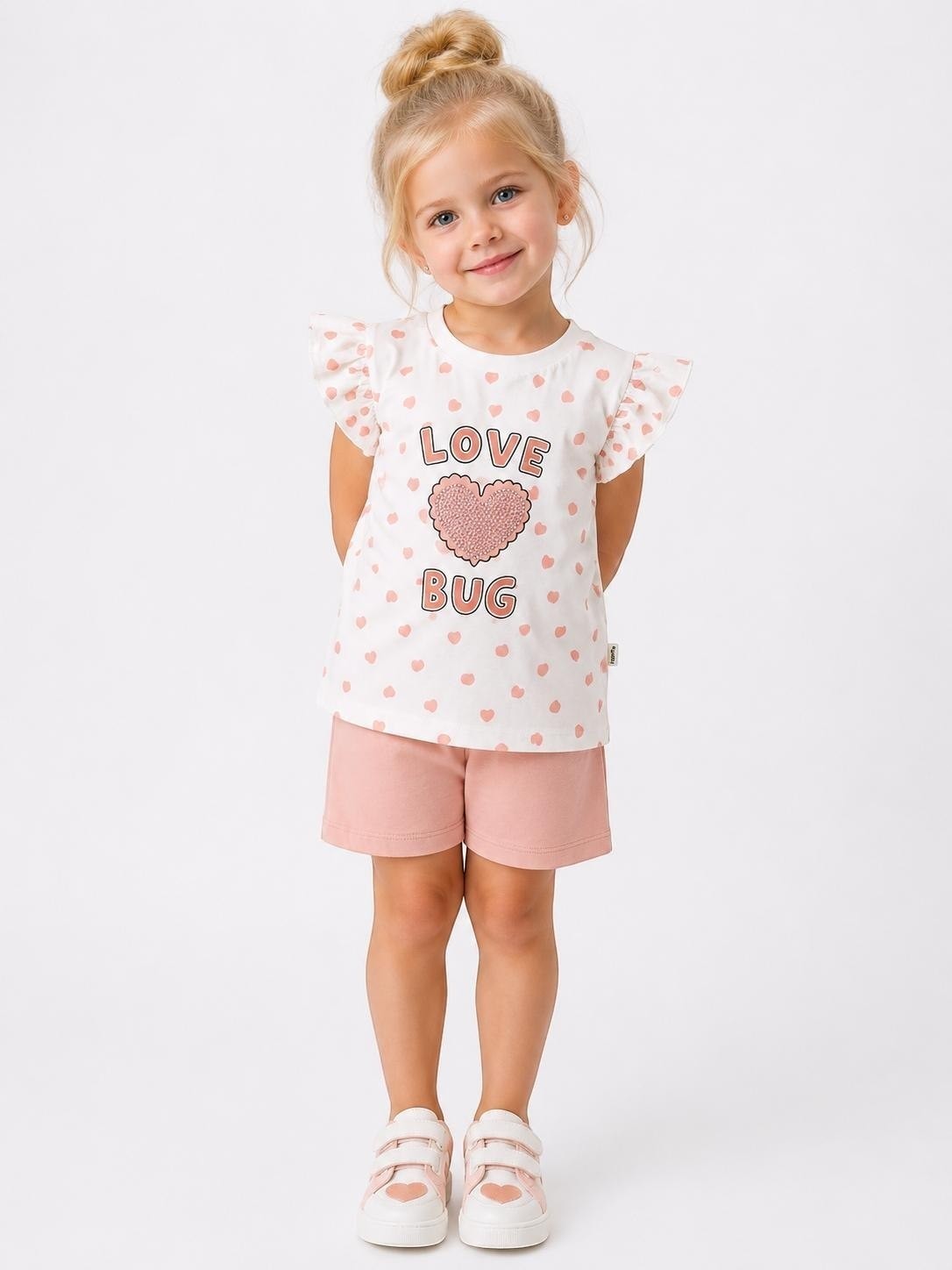 The Nile Luxuries girls heart print t-shirt and shorts set with flutter sleeves and Love Bug graphic on white cotton.