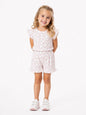 The Nile Luxuries girls' white short set with pink heart print, flutter sleeves, and ruffle trim on top and shorts.