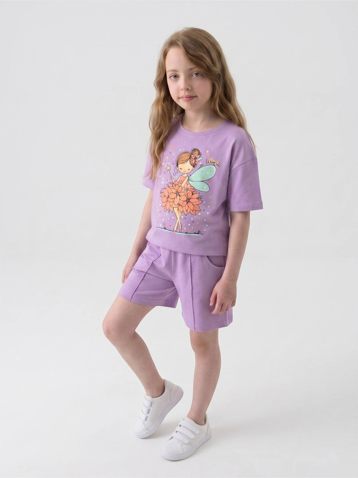 The Nile Luxuries girls lavender graphic t-shirt and shorts set with a fairy print, worn by a young girl.