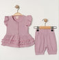 The Nile Luxuries girls lavender ruffle sleeve top and skirt set with eyelet details and elastic waistband.
