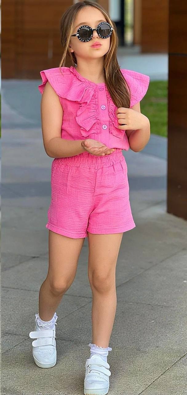 The Nile Luxuries girls' pink cotton gauze ruffled button-front top and elastic waist shorts set.