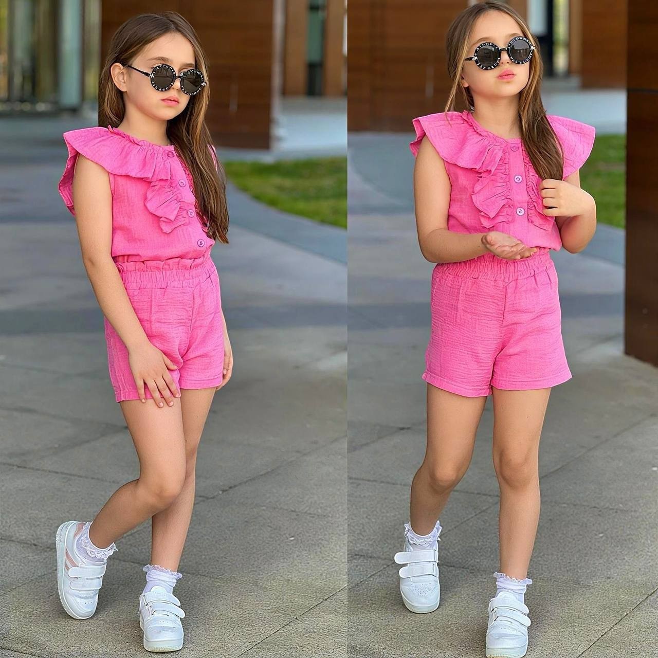 Girl wearing a pink The Nile Luxuries ruffled sleeveless button-down top and matching shorts with white sneakers.