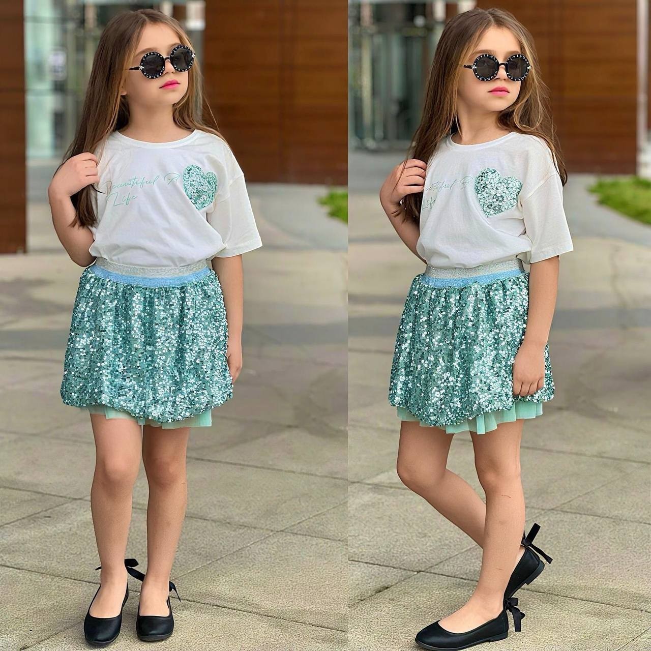 The Nile Luxuries girls outfit with a white t-shirt and a sparkly turquoise sequin skirt, worn by a young girl.