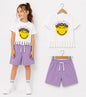 The Nile Luxuries girls' white t-shirt with smiley face graphic and floral crown, paired with lilac shorts. Fringed hem detail.