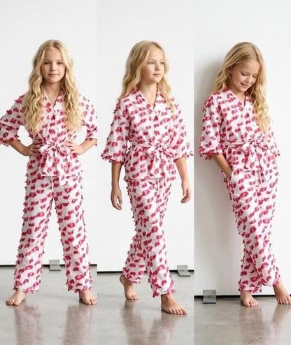 The Nile Luxuries girls two-piece lounge set in white with pink textured dots, featuring a kimono top and tie waist.