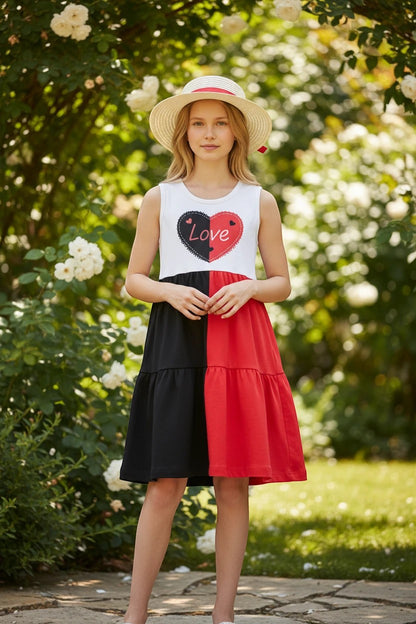 The Nile Luxuries Girls tiered dress with heart graphic and matching hat. White bodice, black and red skirt.