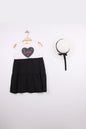 The Nile Luxuries Girls white tiered dress with black skirt, featuring a heart graphic with 'Love' and pink stitching. Includes matching hat.