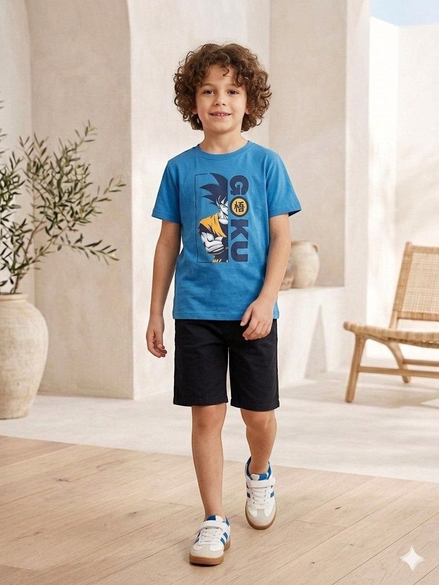 The Nile Luxuries blue Dragon Ball Z Goku graphic t-shirt worn by a boy with black shorts and sneakers