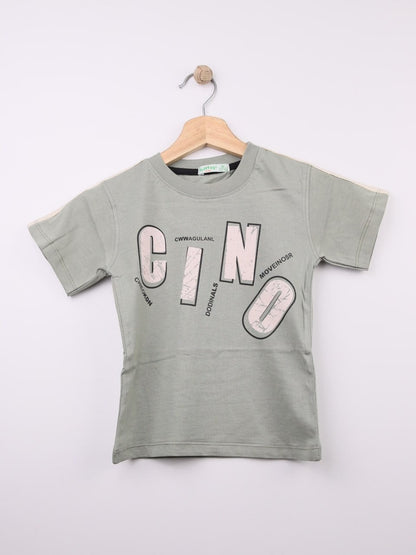 The Nile Luxuries light green cotton t-shirt for kids with abstract graphic print and stylized lettering.