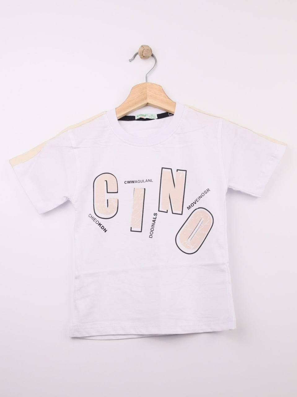 The Nile Luxuries white cotton t-shirt for kids with abstract graphic print and stylized lettering.