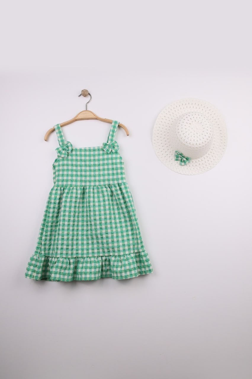 The Nile Luxuries green and white gingham ruffle dress with bow straps and matching hat. Lightweight fabric, perfect for summer.