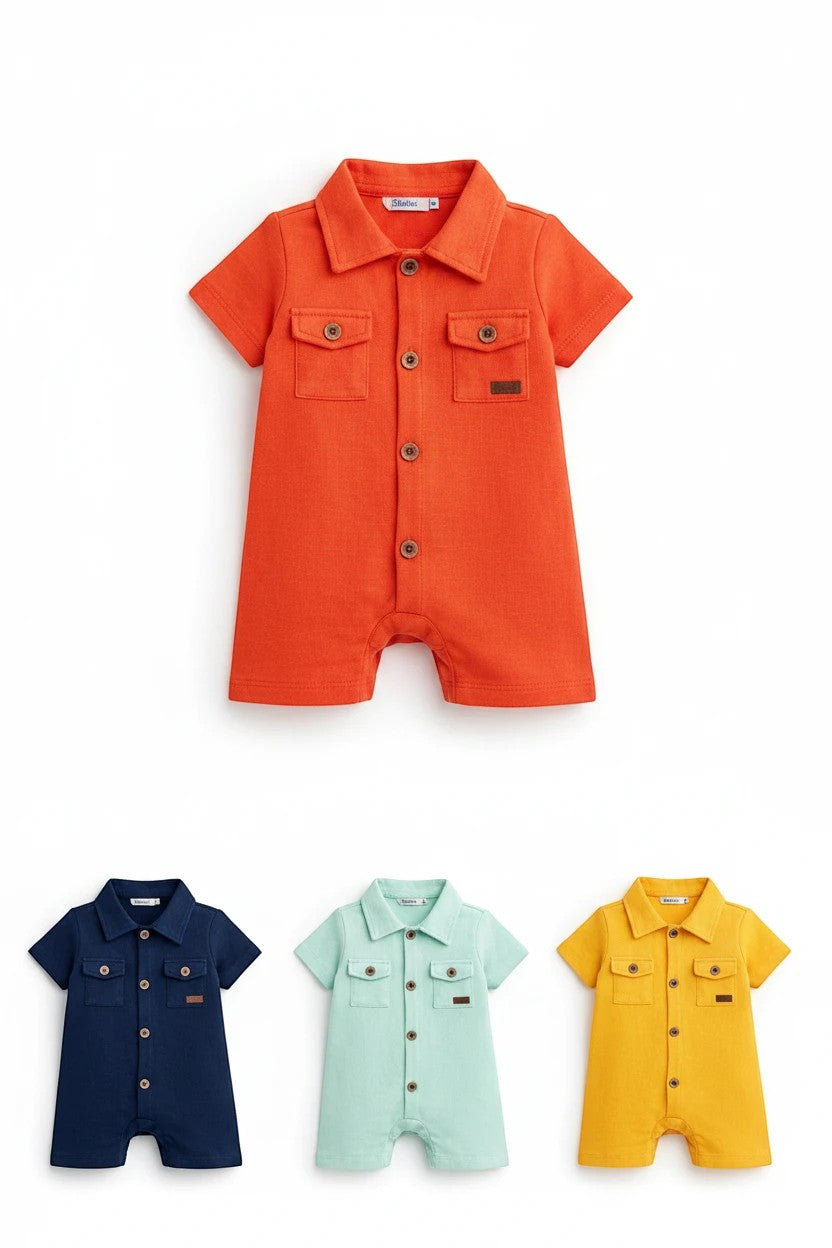 The Nile Luxuries infant short sleeve rompers in orange, navy, mint, and yellow with button-down fronts and pockets.