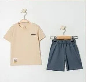 The Nile Luxuries children's beige t-shirt with chest pocket and grey shorts set. Soft, breathable fabric for casual wear.