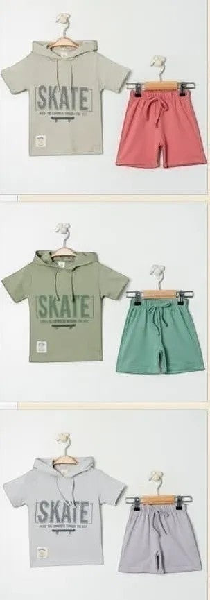 The Nile Luxuries kids short-sleeve hoodie and shorts set in sage green with "SKATE" graphic. Cotton.