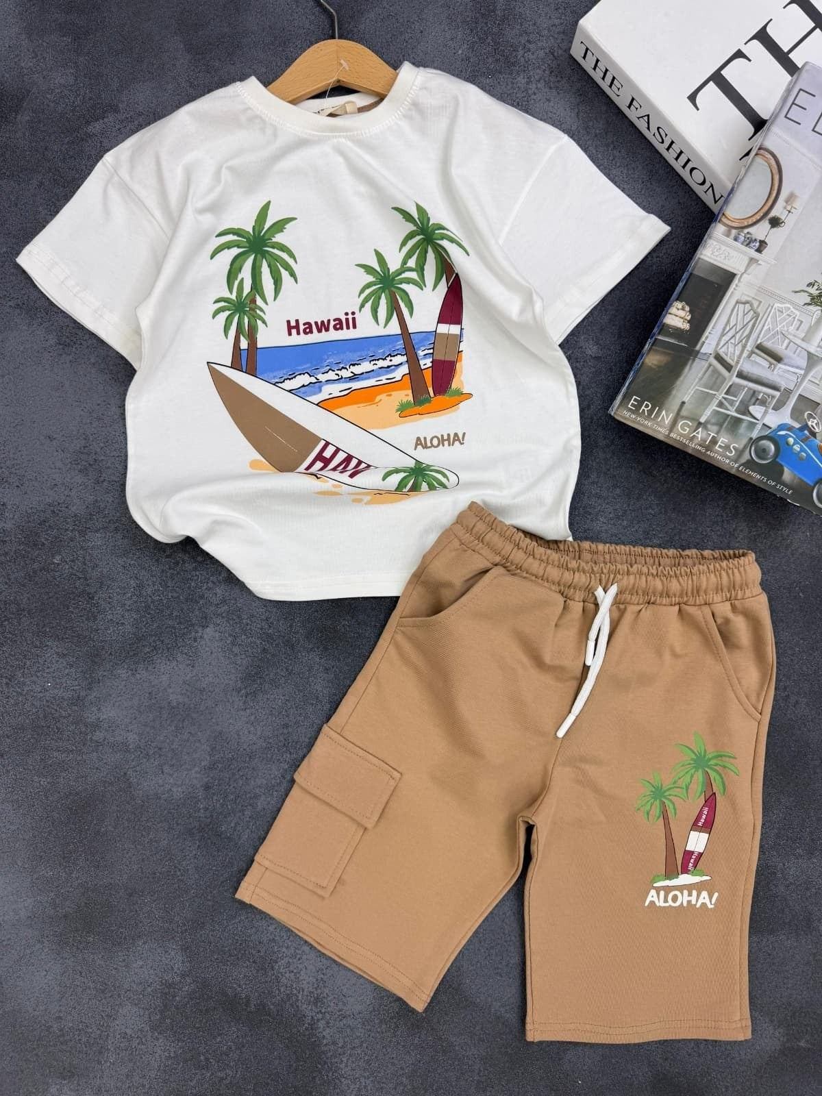 The Nile Luxuries kids summer set with white Hawaii graphic t-shirt and tan cargo shorts with drawstring waist.