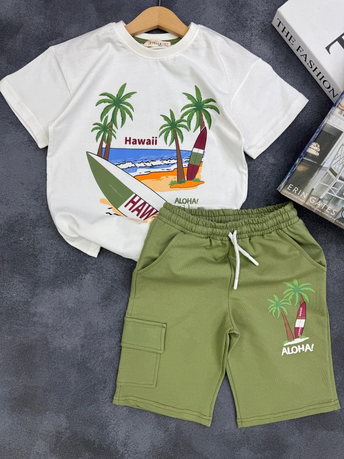 The Nile Luxuries kids summer set with white Hawaii graphic t-shirt and olive green cargo shorts with drawstring.