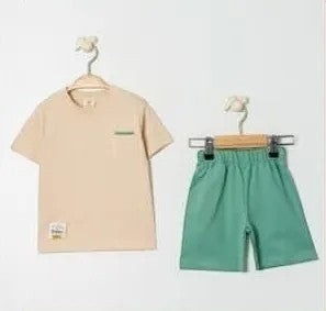 The Nile Luxuries children's beige t-shirt with chest pocket and green shorts set. Soft, breathable fabric, elastic waistband.