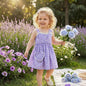 The Nile Luxuries lavender heart print sundress with lace trim and matching purse, worn by a young girl.