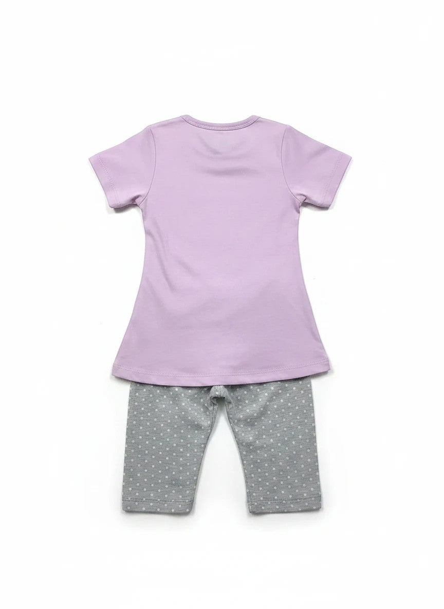 The Nile Luxuries toddler pajama set with a plain lavender t-shirt and grey polka dot pants, back view.