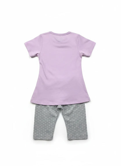 The Nile Luxuries toddler pajama set with a plain lavender t-shirt and grey polka dot pants, back view.