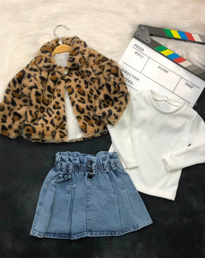 The Nile Luxuries three-piece outfit with a leopard print faux fur jacket, white ribbed top, and pleated denim skirt.