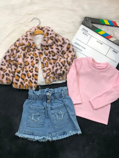 The Nile Luxuries three-piece outfit with a leopard faux-fur jacket, pink ribbed top, and star-pocket denim skirt.