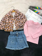 The Nile Luxuries three-piece outfit with a leopard faux-fur jacket, pink ribbed top, and star-pocket denim skirt.