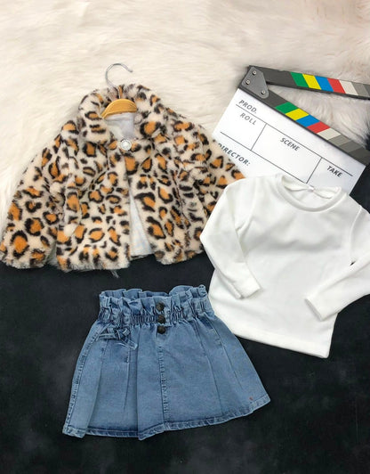 The Nile Luxuries three-piece outfit with leopard print faux fur jacket, white ribbed top, and pleated denim skirt.