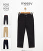 The Nile Luxuries messy Kids Wear classic black chino trousers with button closure and durable tailored fit