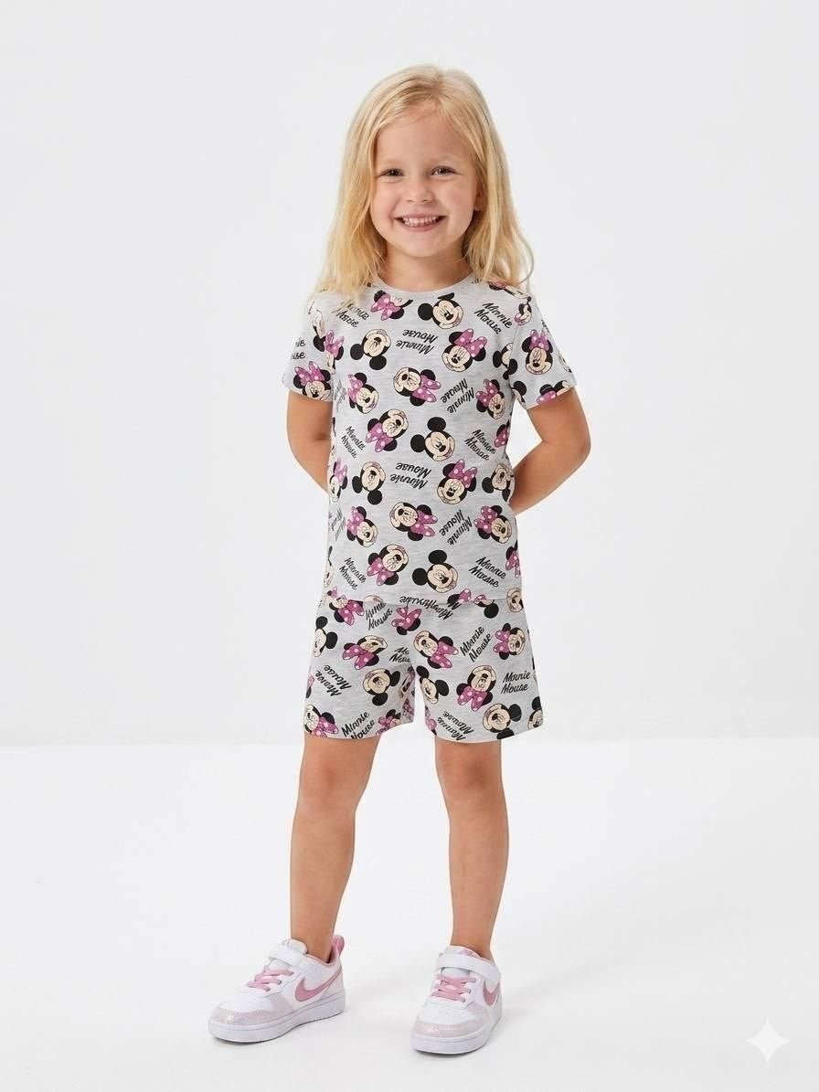Young girl wearing a grey Minnie Mouse print short sleeve t-shirt and shorts set from The Nile Luxuries